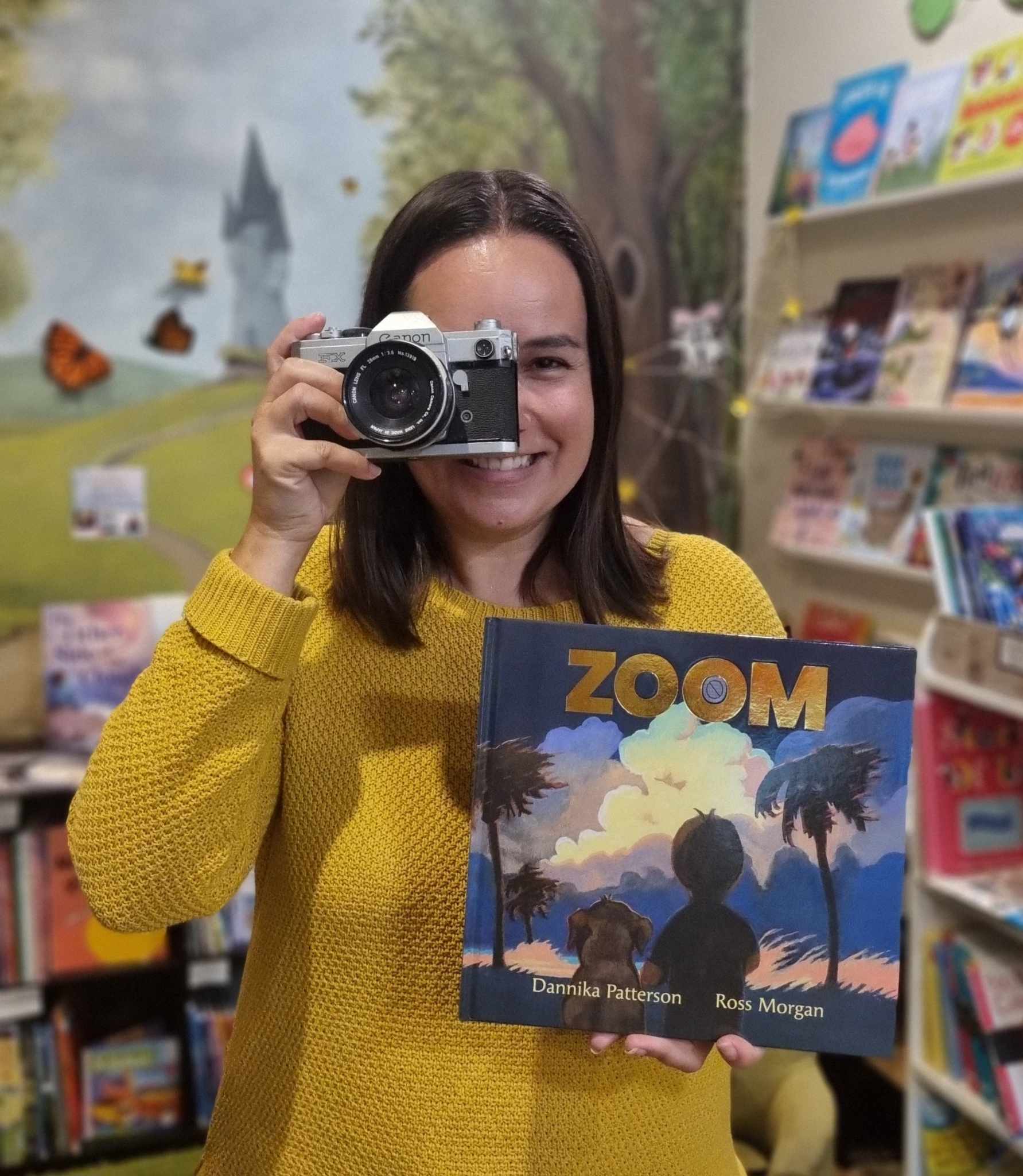Dannika Patterson holding a copy of Zoom